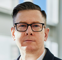 CEO and executive at a crypto trading company, Alexander Hughes, portrait.